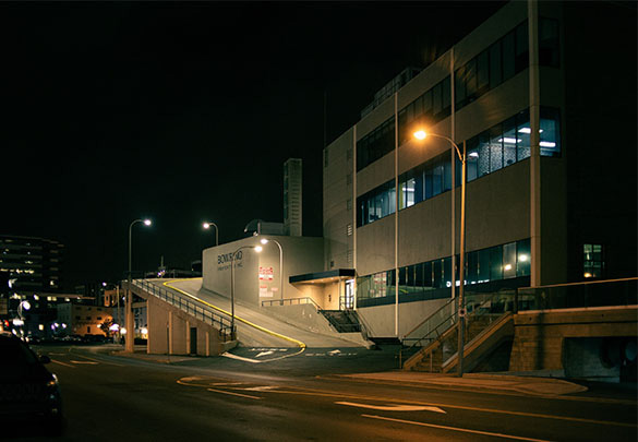 commercial building with parking lot at night